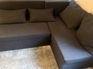 Dunkelgraue L-Couch mit Bett funktion