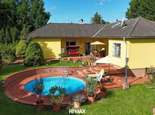 Licht, Luft und Freiheit: Bungalow mit großem 1.622 m2 Garten und Pool, 595000 €, Immobilien-Häuser in 2231 Strasshof an der Nordbahn
