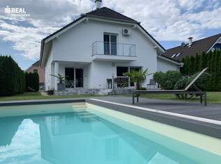 Luxuriöses Wohnen: Designhaus mit Garten, Pool und geräumiger Garage, 699000 €, Immobilien-Häuser in 2473 Gemeinde Potzneusiedl
