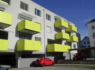 Neubauwohnung in Zentrumslage mit großer Balkon-Loggia und Carport