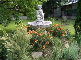 Kleine Wohnung in einem Haus mit großen Garten