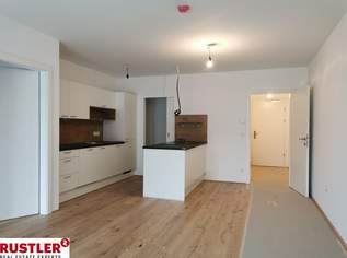 Hofseitig ausgerichtete 2-Zimmer-Wohnung mit großem Balkon und Hochbeet, 1069.11 €, Immobilien-Wohnungen in 1230 Liesing